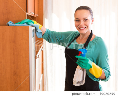 Woman cleaning office room. 19020259