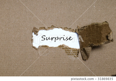 The word surprise appearing behind torn paper 31869835