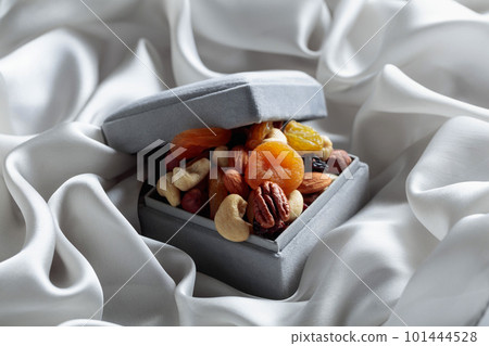 Dried fruits and nuts in a gift box. 101444528