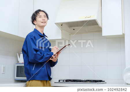 Worker inspecting the kitchen 102492842