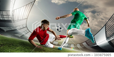 Dynamic image of professional football players in motion during game at 3D open air stadium. Concentration and motivation 103875005