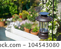 Charging a solar lantern with sunlight 104543080