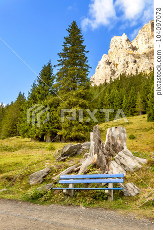 Blue bench near Oeschinnensee lake, Switzerland 104097078