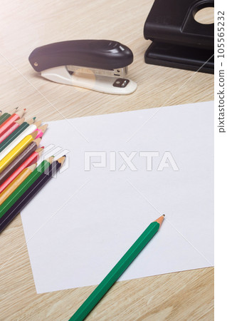 Stationery and blank paper on wooden table 105565232