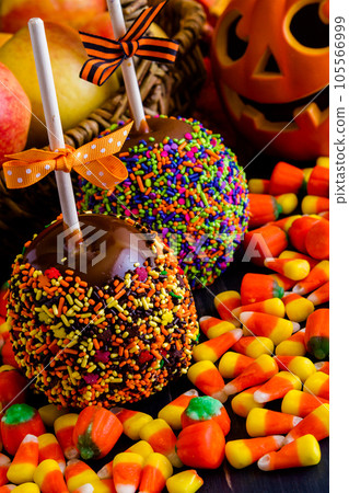 Hand dipped caramel apple covered with multi color sprinkles. 105566999