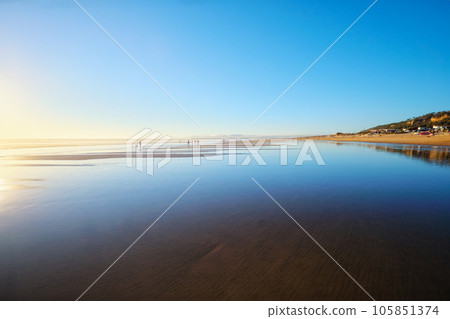 Atlantic ocean sunset with surging waves at Fonte da Telha beach, Costa da Caparica, Portugal 105851374