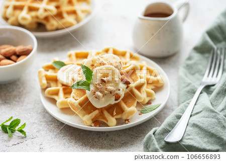 Belgian waffles with fruit, bananas and honey. Homemade baking. 106656893