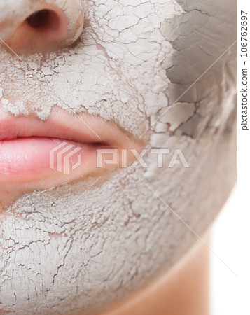 Skin care. Woman applying clay mask on face. Spa. 106762697