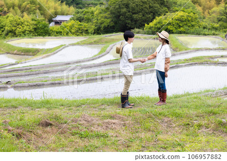 rice field and young couple 106957882