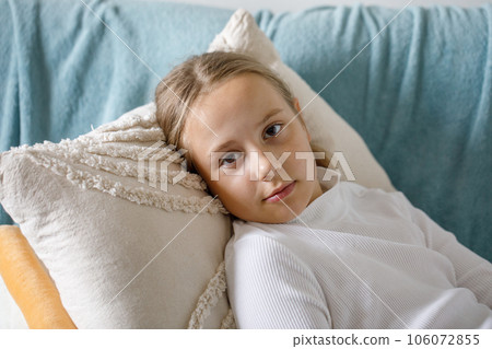 Cute child girl lying on bed at home 106072855