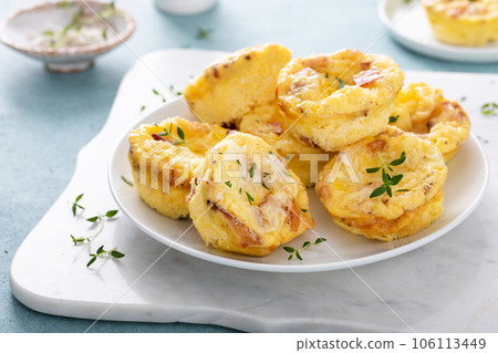 Bacon and cheddar egg muffins for breakfast 106113449