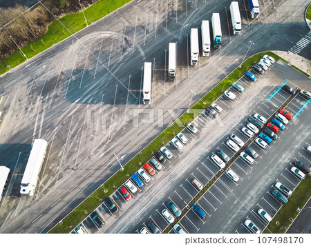 Aerial view of two parking lots, one for trucks and one for cars  107498170