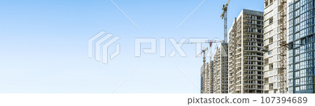 Construction Building site banner background. Construction crane with new apartment skyscraper building. Building industry technology, business, urban concept 107394689