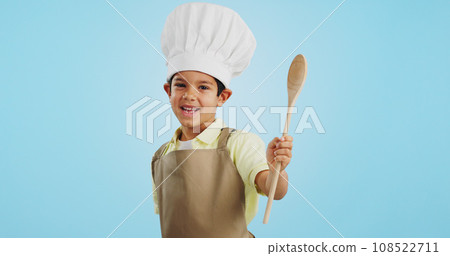 Happy, face and child with a spoon for baking, young chef or getting ready for the kitchen. Smile, boy kid or portrait with equipment for cooking, future career or preparation on a studio background 108522711