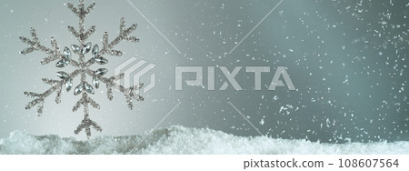 Decorative Christmas Flake with Bokeh Lights and Falling Snow Flakes 108607564