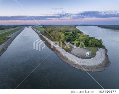 upstream entry to the Chain of Rock Bypass Canal from the Mississippi River above St Louis, aerial view at October dawn 108159477