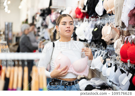 Young woman choosing bra in store 109576628