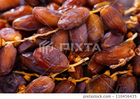 Fresh dates on wooden background, healthy snack 110456435