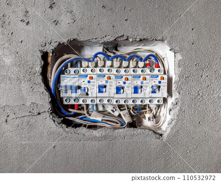 Electric breaker panel, distribution board, electricity panelboard in wall 110532972