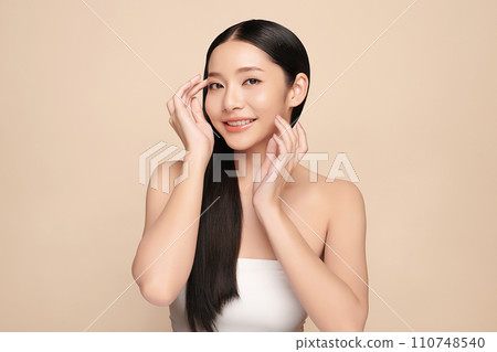 Beautiful young asian woman with clean fresh skin on beige background, Face care, Facial treatment, Cosmetology, beauty and spa, Asian women portrait. 110748540