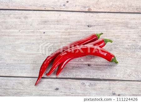 Hot and spicy chili pepper 111224426