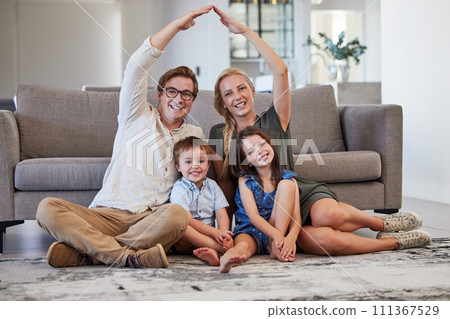 Family home with parents, kids and roof sign for real estate, moving house property and life insurance policy, cover and support. Portrait of mom, dad and rooftop over children in lounge for security 111367529