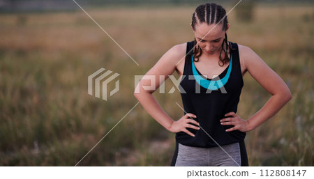 Close-Up Portrait of Determined Athlete Resting After Intense Workout 112808147