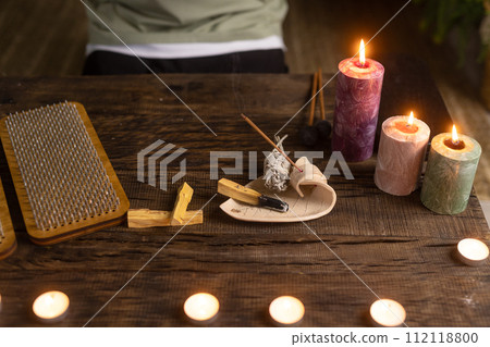 Sadhu board, yoga board with nails, guy stands on the board with nails, yoga concept 112118800