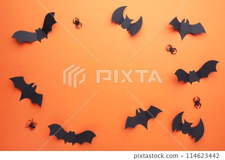 Halloween paper bats with spiders on orange background. Halloween concept 114623442