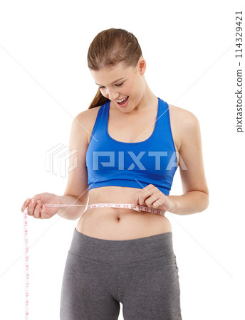 Goals of woman, surprise and measuring tape in studio for measurement, happy and excited for results of diet. Female person, body and care for calories target, weight loss and white background 114329421