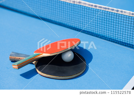 tennis rackets for playing ping pong on blue table, ping pong concept 115522578