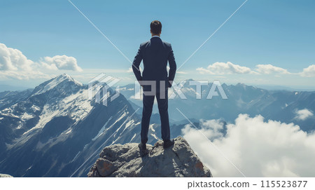 A businessman stands proudly on top of a mountain. The concept of Success, Achievement, and Perseverance in business. Generative AI. 115523877