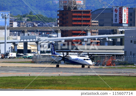 Osaka International Airport ANA Bombardier DHC8-Q400 Propeller Aircraft Takeoff Ready Sky Park 115607714