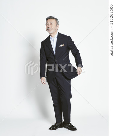 Middle-aged businessman on white background (full body) 115262500