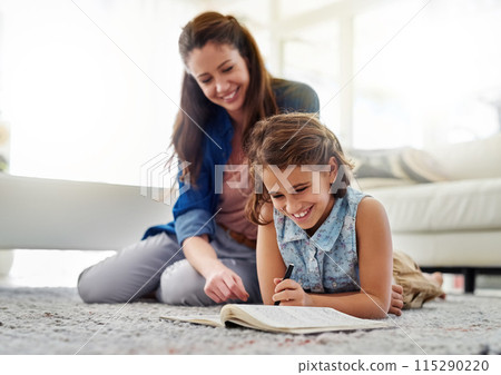 Mother, girl and help with book on floor for learning, homeschool and writing for essay or english literature assignment. Mom, daughter and together on mat in home for education and knowledge. 115290220