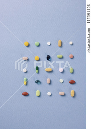 colorful pills arranged in a square shape 115391108