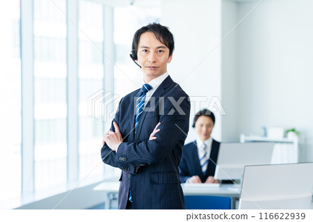 Japanese male operator working in an office 116622939