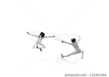 Two young female athletes during fencing match, showcasing their speed and precision in practice bout against white studio background. 116361066