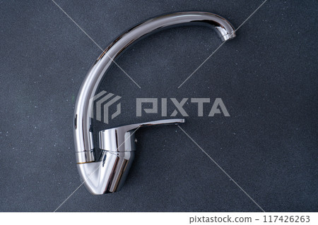 Chrome-plated mixer tap for water in the bathroom and kitchen. Plumbing. 117426263