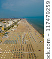 Beach in Rimini view from above. Adriatic Sea coast. View of the long beach with umbrellas and sun loungers 117479259