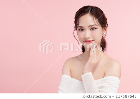 Beautiful young asian woman with clean fresh skin on pink background, Face care, Facial treatment, Cosmetology, beauty and spa, Asian women portrait. 117587643