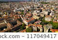 Roof of the University of Milan and city buildings top down view. Milan cityscape against a background of blue sky, view from above in sunny weather 117049417