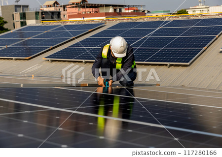 Engineers walking on roof inspect and check solar cell panel 117280166