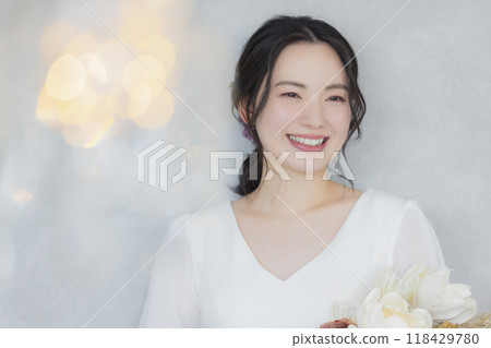 Young woman in a wedding dress 118429780