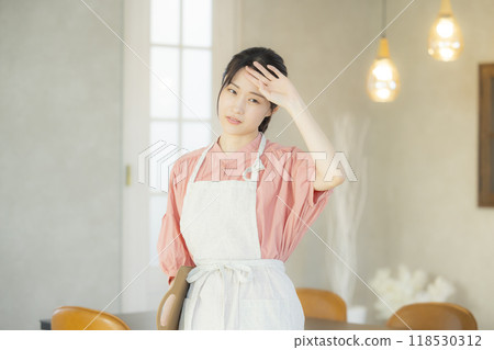 Tired apron woman 118530312