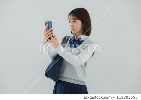 High school girl with a smartphone 118803555