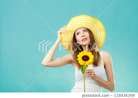 portrait attractive woman with sunflower 118836399