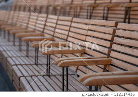 Wooden Seats Row Outdoor - Closeup of wooden seats in a row outdoors. 118114436