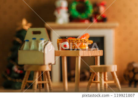 Bread and jam on a table in front of a Christmas fireplace 119921807