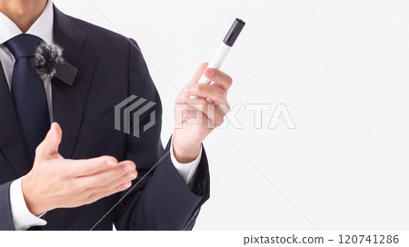 A person giving an explanation in front of a whiteboard (stock photo) 120741286